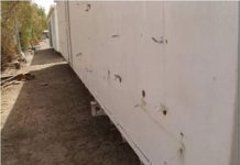 Schwere Beschädigung der behindertengerechten Wohncontainer durch irakische Truppen